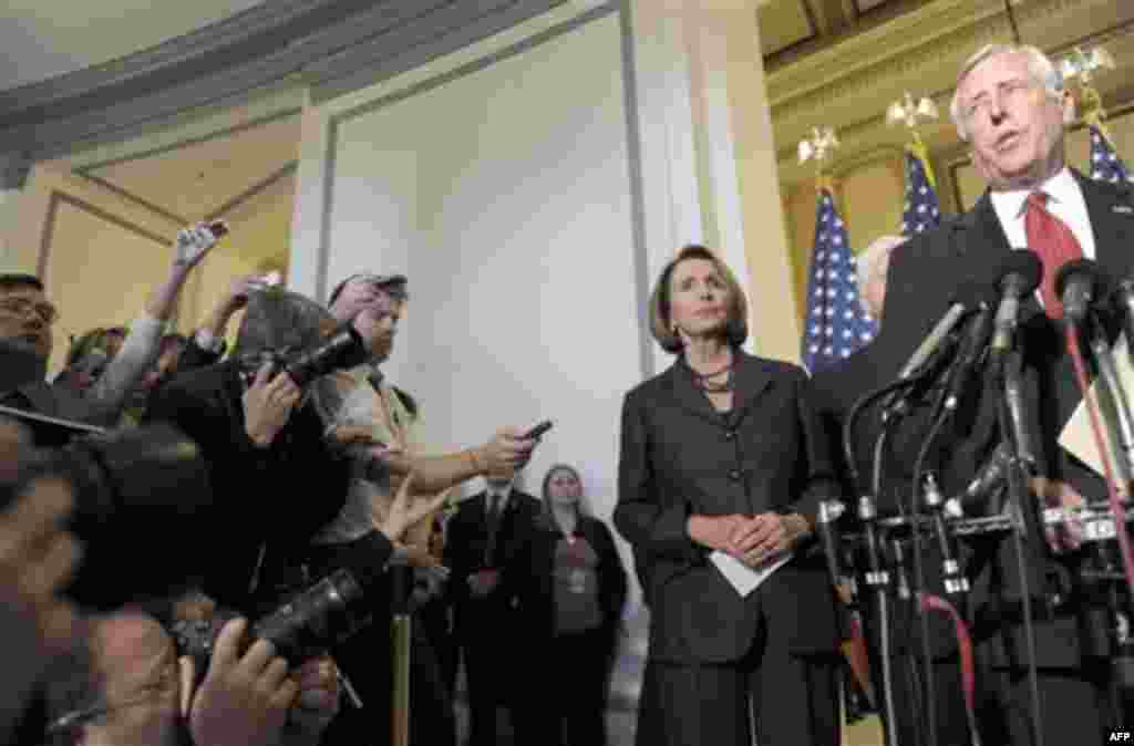 House Speaker House Nancy Pelosi of Calif., listens as House Majority Leader Steny Hoyer of Md., speaks during a news conference on Capitol Hill in Washington, Wednesday, Nov. 17, 2010, after the Democratic House Caucus for re-elected Pelosi as their lead