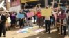 FILE: Zimbabweans stage protest over the introduction of the national pledge.