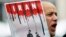 FILE - An Iranian exile shouts slogans to protest against executions in Iran during a demonstration in front of the Iranian embassy in Brussels on December 29, 2010.