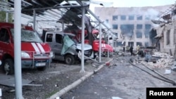 Vehicles destroyed by a Russian missile strike are seen at a damaged fire depot compound in Dnipro, Ukraine May 22, 2023 in this still image taken from handout video. Press service of the State Emergency Service of Ukraine in Dnipropetrovsk region/Handout via REUTERS