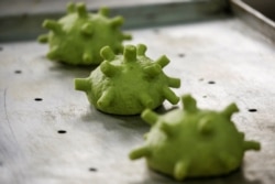 Burger buns shaped like a coronavirus are seen prior to being baked at a restaurant in Hanoi, Vietnam, March 25, 2020.