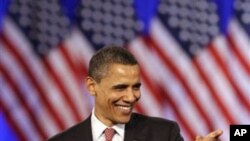 President Barack Obama smiles as he points to his supporters at a DNC fundraising event at Navy Pier in Chicago, Thursday, April 14, 2011