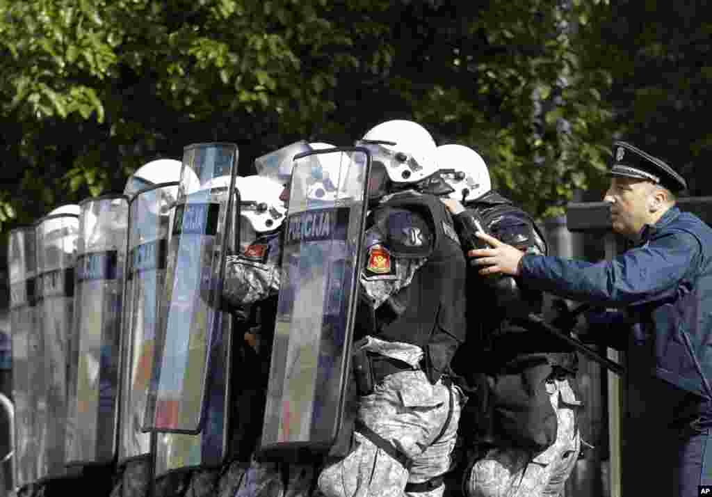 Montenegro police officers guard a government building during a protest in Podgorica. The demonstrators demanded the resignation of the government of long-standing Prime Minister Milo Djukanovic. They accuse his government of rampant corruption, unemployment and economic mismanagement.