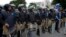 Pakistan Pakistani police officers surround the Supreme Court building Aug 2, 2013. Police are on alert against potential militant attacks in the capital, Islamabad. 