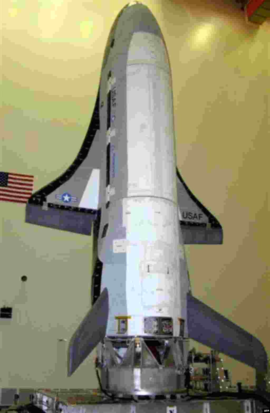 This undated photo released by Vandenberg Air Force Base shows the X-37B Orbital Test Vehicle, or OTV. The U.S. Air Force's secrecy-shrouded X-37B unmanned spaceplane returned to Earth early Friday after more than seven months in orbit on a classified mis