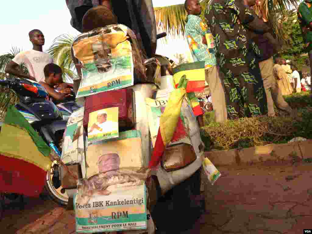 A man searches for his name on a list of eligible voters at an election center in Bamako, Mali, July 23, 2013. 