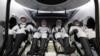 FILE - Roscosmos cosmonaut Alexander Grebenkin, left, and NASA astronauts, left to right, Michael Barratt, Matthew Dominick and Jeanette Epps in the SpaceX Dragon Endeavour spacecraft after landing in the Gulf of Mexico, Oct. 25, 2024. (NASA/Joel Kowsky via AP)