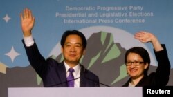 FILE - Taiwanese President-elect Lai Ching-te and Vice President-elect Hsiao Bi-khim wave as they hold a press conference following their election victory in Taipei on Jan. 13, 2024.