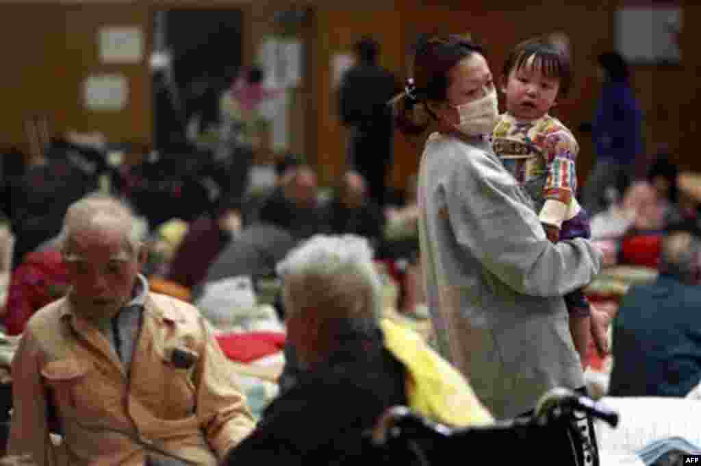 Evacuees rest in a shelter in Soma city, Fukushima prefecture, Japan, Monday, March 14, 2011, three days after a massive earthquake and tsunami struck the country's north east coast. On top of the losses of family and friends along with property, evacuees