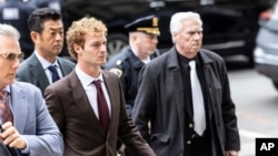 Daniel Penny, center, arrives at criminal court, Dec. 9, 2024, in New York. A Manhattan jury cleared Penny of criminally negligent homicide in Jordan Neely's 2023 death. 