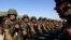 FILE - Afghan soldiers take their oaths before a training exercise at the Kabul Military Training Center, Oct. 22, 2014. 