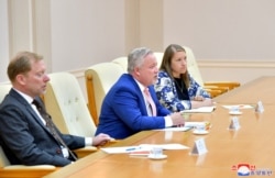 Special Envoy of the Swedish government Kent Harstedt and his party meet with North Korea's Foreign Minister Ri Yong Ho during a courtesy call, in this undated photo released July 4, 2019.