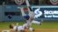 FILE - New York Mets shortstop Ruben Tejada suffered a broken leg on this play when Los Angeles Dodgers second baseman Chase Utley rolled toward him to try to break up a double play in a National League playoff game at Dodger Stadium, Oct 10, 2015.