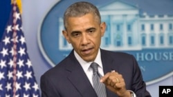 President Barack Obama speaks about the situation in Ukraine in the press briefing room of the White House, July 18, 2014. 