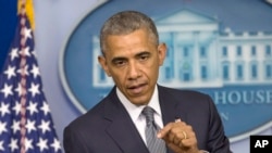 President Barack Obama speaks about the situation in Ukraine in the press briefing room of the White House, July 18, 2014.