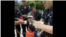 据信带着孩子的P2P受害人王倩遭警察驱赶 (推特视频截图)