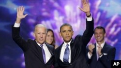 Vice President Joe Biden and President Barack Obama wave at the Democratic National Convention in Charlotte, North Carolina. 