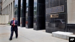 FILE - A man walks out of the Export-Import Bank, July 28, 2015, in Washington D.C. 