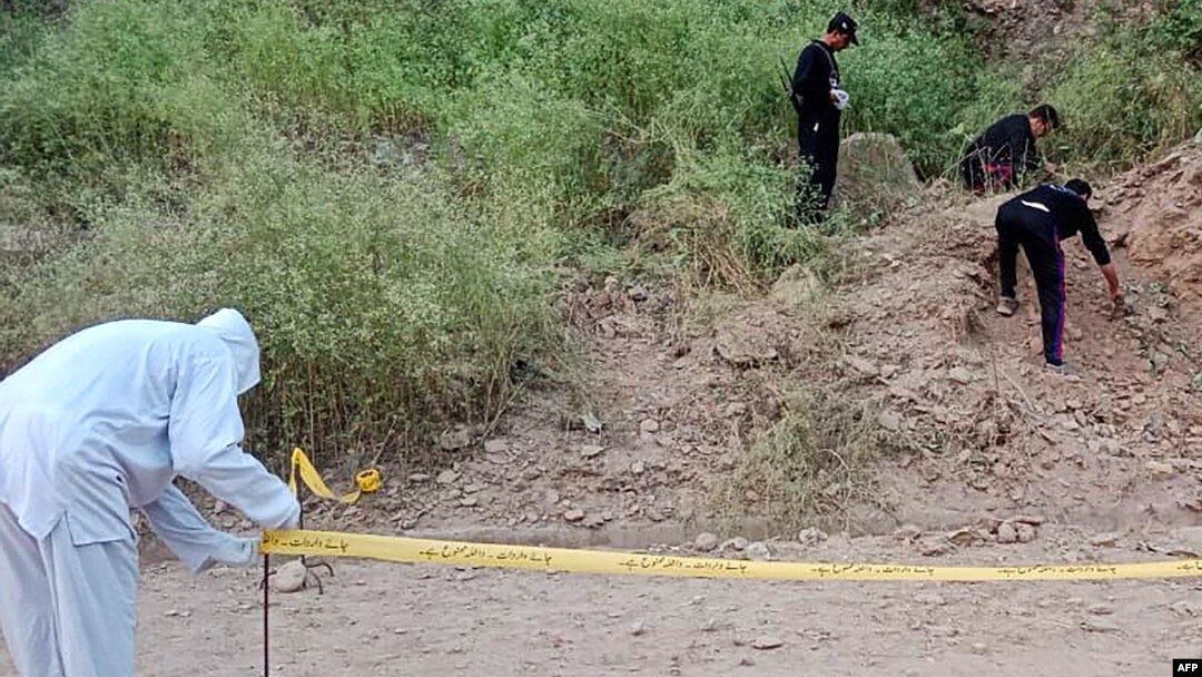 Security personnel examine the site of a bomb explosion, at Malam Jabba in the Swat district of Khyber Pakhtunkhwa province on Sept. 2, 2024. A roadside bomb hit a convoy of foreign diplomats in the northwest, police said.