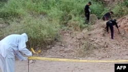 Security personnel examine the site of a bomb explosion, at Malam Jabba in the Swat district of Khyber Pakhtunkhwa province on Sept. 2, 2024. A roadside bomb hit a convoy of foreign diplomats in the northwest, police said.