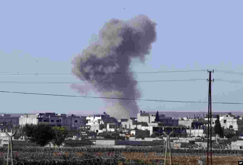 Smoke rises after an airstrike in Kobani, Syria, Oct. 7, 2014.