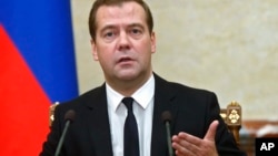 ນາຍົກລັດຖະມົນຕີ ຣັດເຊຍ ທ່ານ Dmitry Medvedev ກ່າວຄຳປາໄສໃນລະຫວ່າງກອງປະຊຸມຄະນະລັດຖະບ່ນ
ໃນນະຄອນຫຼວງ ມົສກູ. 7 ສິງຫາ, 2014.