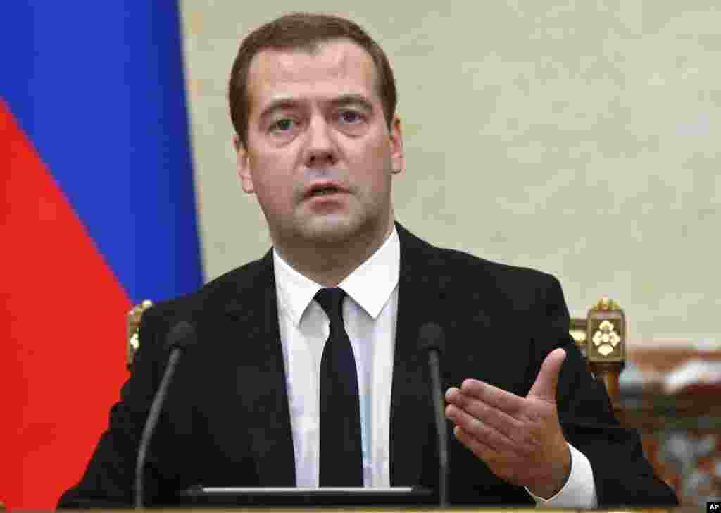 Premier Dmitry Medvedev at the Cabinet meeting&nbsp;announces sanctions, on behalf of the Russian government, banning all imports of meat, fish, milk and milk products, fruits and vegetables from the United States, European Union, Australia, Canada and Norway in Moscow on Thursday, Aug. 7, 2014.