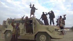 Houthi fighters pose on an alleged captured Saudi vehicle after an attack near the border with Saudi Arabia's southern region of Najran in Yemen, in this still image taken from video on Sept. 29, 2019.