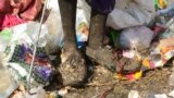 An Indian woman collects recyclable items at a garbage dump on the outskirts of Hyderabad.