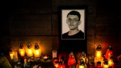 Candles and an image of investigative journalist Jan Kuciak are left outside Aktuality, the Slovakian news outlet where he worked. (Vladimir Simicek | AFP)