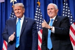 FILE - President Donald Trump and Vice President Mike Pence stand on stage during the first day of the 2020 Republican National Convention in Charlotte, NC, Aug. 24, 2020.