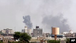 FILE - Smoke rises after an airstrike by the Saudi-led coalition in Sanaa, Yemen, Sept. 6, 2015.