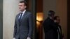 French President Emmanuel Macron accompanies a guest after a meeting at the Elysee Palace in Paris, Jan. 12, 2018.