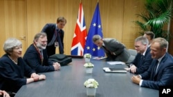European Council President Donald Tusk, right, meets with British Prime Minister Theresa May, left, during a bilateral meeting on the sidelines of an EU summit in Brussels, Belgium, June 22, 2017.