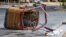 The basket of a hot air balloon that crashed lies on the pavement in Albuquerque, NM, June 26, 2021. 
