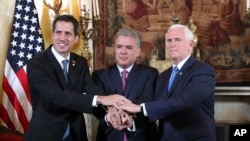 Venezuela's self-proclaimed interim president Juan Guaido, Colombia's President Ivan Duque and Vice President Mike Pence, pose for a photo after a meeting of the Lima Group concerning Venezuela at the Foreign Ministry in Bogota, Colombia, Monday, Feb. 25, 2019. 