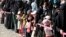 Women and girls queue for Iftar (breaking of fast) meals supplied by a local charity during the holy month of Ramadan in Sana'a, Yemen June 12, 2016. 