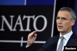 FILE - NATO Secretary-General Jens Stoltenberg talks to reporters at a NATO defense ministers meeting at the alliance headquarters in Brussels, Belgium, Nov. 8, 2017.