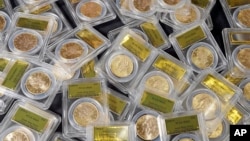 Some of 1,427 Gold-Rush era U.S. gold coins are displayed at Professional Coin Grading Service in Santa Ana, Calif., Tuesday, Feb. 25, 2014.
