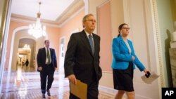 Senate Majority Leader Mitch McConnell walks from his office to the Senate floor on Capitol Hill in Washington, April 23, 2015.