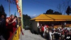Tibetan spiritual leader Dalai Lama, left, greets devotees at the Pemayangtse Monastry in Pelling, about 120 kilometers (75 miles) west of Gangtok, India, Wednesday, Dec. 15, 2010. The Dalai Lama is on an eight-day visit to Sikkim state.