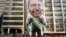 FILE - Supporters of presidential front-runner Jair Bolsonaro exhibit a large, inflatable doll in his image as they march along Paulista Avenue in Sao Paulo, Brazil, Sept. 9, 2018.