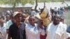 Mourners carry the body of Somali lawmaker Abdiaziz Isaq Mursal for burial in the Somali capital, Mogadishu, Tuesday April 22, 2014.