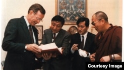 FILE - President George H.W. Bush with Lodi Gyari, Tenzing N. Tethong and His Holiness the Dalai Lama in 1991.