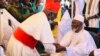 Le cardinal Philipe Ouédraogo, archevêque de Ouagadougou allant saluer l’iman après la prière de Ramadan, Ouagadougou, le 13 mai 2021. (VOA/Lamine Traoré)