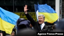 Ukraine's former leader Petro Poroshenko addresses supporters after his arrival at an airport some 40 kilometres outside Kyiv on Jan. 17, 2022.