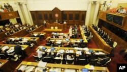 Legislative Councillers vote on a political reform package in Hong Kong on June 24, 2010. Hong Kong lawmakers approved a plan to broaden the electoral base for the city's leader, stopping well short of one person, one vote for the Chinese territory's seve