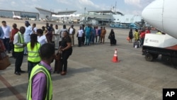 FILE - Passengers are searched before boarding a flight at the Nnamdi Azikiwe International Airport in Abuja, Nigeria, Oct. 15, 2016. Nigeria will close the airport for six weeks to repair the runway.