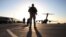 FILE - A solider stands guard near a military aircraft in Kandahar, Afghanistan.