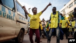 Supporters of the National Resistance Movement (NRM) celebrate the victory of President Yoweri Museveni after the results of the presidential election in Kampala, Uganda, on Jan. 16, 2021.